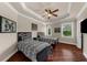 Bedroom featuring two twin beds, a ceiling fan, and hardwood floors at 932 Shadowford Fls, Lithonia, GA 30058