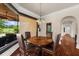 Charming breakfast nook with a view of the lush backyard and outdoor seating area at 932 Shadowford Fls, Lithonia, GA 30058