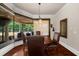 Cozy breakfast nook featuring a bay window overlooking the landscaped backyard and patio at 932 Shadowford Fls, Lithonia, GA 30058