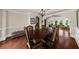 Elegant dining room featuring hardwood floors, wainscoting, and an ornate chandelier at 932 Shadowford Fls, Lithonia, GA 30058