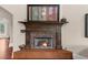 Cozy fireplace with decorative tile surround and hearth, perfect for relaxing evenings at 932 Shadowford Fls, Lithonia, GA 30058