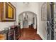 Elegant foyer with hardwood floors, arched doorways, decorative doors, and a view of the staircase at 932 Shadowford Fls, Lithonia, GA 30058