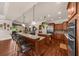 Gourmet kitchen with bar seating, stainless steel appliances, and granite countertops at 932 Shadowford Fls, Lithonia, GA 30058