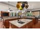 Gourmet kitchen with granite countertops, island sink, dark wood cabinets, open to the Gathering room at 932 Shadowford Fls, Lithonia, GA 30058