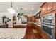 Gourmet kitchen with granite countertops, stainless steel appliances, and custom wood cabinets at 932 Shadowford Fls, Lithonia, GA 30058