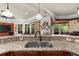 Kitchen sink with granite countertops and tile backsplash overlooking the rest of the house at 932 Shadowford Fls, Lithonia, GA 30058