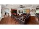 Spacious living room with hardwood floors, a large sectional sofa, and a media center at 932 Shadowford Fls, Lithonia, GA 30058