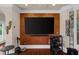 Cozy living room featuring a large flat screen TV and an accent wall at 932 Shadowford Fls, Lithonia, GA 30058