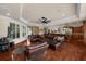 Spacious living room with hardwood floors and a leather sectional sofa and open to the kitchen area at 932 Shadowford Fls, Lithonia, GA 30058