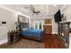 Spacious main bedroom with hardwood floors, fireplace, tray ceiling, and access to balcony at 932 Shadowford Fls, Lithonia, GA 30058