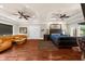 Expansive main bedroom features a luxurious leather bed and seating area with rich hardwood floors at 932 Shadowford Fls, Lithonia, GA 30058