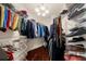 Spacious walk-in closet with hardwood floors, ample shelving and custom storage for organization at 932 Shadowford Fls, Lithonia, GA 30058