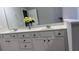 Bathroom featuring a double vanity, large mirror, and white cabinets at 4990 Arbor View Nw Pkwy, Acworth, GA 30101