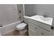 Well-lit bathroom featuring a shower-tub combo, toilet, and white vanity at 4990 Arbor View Nw Pkwy, Acworth, GA 30101