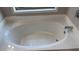 Soaking tub featuring clean lines and a modern faucet at 4990 Arbor View Nw Pkwy, Acworth, GA 30101