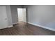 Bedroom featuring modern hardwood flooring and two doors at 4990 Arbor View Nw Pkwy, Acworth, GA 30101