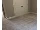 The bedroom has carpet flooring, white baseboards, and a double-door closet for ample storage at 4990 Arbor View Nw Pkwy, Acworth, GA 30101