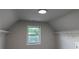 Walk-in closet featuring neutral paint, a window, and shelving units at 4990 Arbor View Nw Pkwy, Acworth, GA 30101