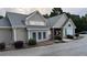 Image of the community clubhouse featuring lush landscaping, neutral colors, and architectural details at 4990 Arbor View Nw Pkwy, Acworth, GA 30101