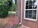Exterior facade reveals brick accents, siding, a bright window, and a lush landscape at 4990 Arbor View Nw Pkwy, Acworth, GA 30101