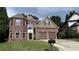 Charming brick home with a well-manicured lawn and two-car garage in a desirable neighborhood at 4990 Arbor View Nw Pkwy, Acworth, GA 30101