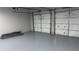 View of the garage, with epoxy flooring and insulated garage doors at 4990 Arbor View Nw Pkwy, Acworth, GA 30101