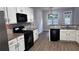 Kitchen featuring granite countertops, white cabinets and stainless steel appliances at 4990 Arbor View Nw Pkwy, Acworth, GA 30101