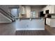 Kitchen featuring stainless steel refrigerator, black oven, granite countertop, and white cabinets at 4990 Arbor View Nw Pkwy, Acworth, GA 30101