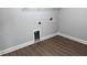 Laundry room with wood grain vinyl flooring and washer hookups at 4990 Arbor View Nw Pkwy, Acworth, GA 30101