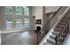 Elegant living room featuring high ceilings, fireplace, and stairs to the second floor at 4990 Arbor View Nw Pkwy, Acworth, GA 30101