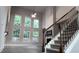 Bright living room showcasing hardwood floors, fireplace, and staircase at 4990 Arbor View Nw Pkwy, Acworth, GA 30101