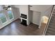 Aerial view of a living room with hardwood floors, fireplace, and staircase at 4990 Arbor View Nw Pkwy, Acworth, GA 30101