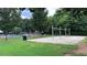 Image showcasing the community playground with a swing set and the community pool with umbrellas at 4990 Arbor View Nw Pkwy, Acworth, GA 30101