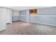 Finished basement area with unique flooring, painted walls, and built in storage at 1341 Little Deer Run, Canton, GA 30114