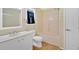 Bathroom with a single sink vanity, tub/shower combo, and neutral color scheme at 1341 Little Deer Run, Canton, GA 30114