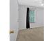 Spacious bedroom featuring a window, ceiling fan and closet at 1341 Little Deer Run, Canton, GA 30114