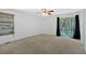 Bright bedroom features a ceiling fan, and glass doors leading to an outdoor space at 1341 Little Deer Run, Canton, GA 30114