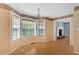 Bright dining room with hardwood floors and large windows, perfect for gatherings at 1341 Little Deer Run, Canton, GA 30114
