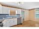 Functional kitchen with white cabinets and stainless steel appliances at 1341 Little Deer Run, Canton, GA 30114
