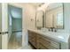 Bright bathroom featuring a double vanity, modern fixtures, and ample lighting at 1348 Branchwood Dr, Snellville, GA 30078