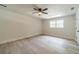 Spacious bedroom with ceiling fan, natural light, and new floors, creating a welcoming atmosphere at 1348 Branchwood Dr, Snellville, GA 30078