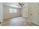 Bedroom featuring new flooring, ceiling fan, neutral paint, window, and natural light at 1348 Branchwood Dr, Snellville, GA 30078