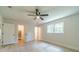 Bedroom features light wood flooring, a ceiling fan, and a walk-in closet at 1348 Branchwood Dr, Snellville, GA 30078
