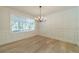 Formal dining room with light wood floors and a classic chandelier at 1348 Branchwood Dr, Snellville, GA 30078