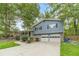 Charming two-story home with blue siding, brick accents, and a two-car garage at 1348 Branchwood Dr, Snellville, GA 30078