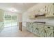 Updated kitchen featuring new cabinets, granite countertops, stainless appliances and sliding glass doors to the backyard at 1348 Branchwood Dr, Snellville, GA 30078