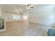 Bright and spacious living area with light wood floors and access to the dining room at 1348 Branchwood Dr, Snellville, GA 30078