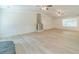Expansive living area with light wood floors and access to the back entry at 1348 Branchwood Dr, Snellville, GA 30078