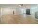 Spacious living room with light wood floors, a stone fireplace, and lots of windows at 1348 Branchwood Dr, Snellville, GA 30078