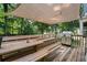 Spacious deck with bench seating, a shade awning, and a grill at 2208 Mountain Springs Nw Ct, Kennesaw, GA 30144